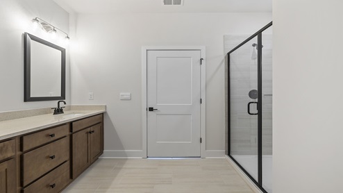Primary bathroom with double vanity sinks.