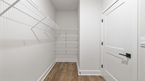 Primary closet with shelves.