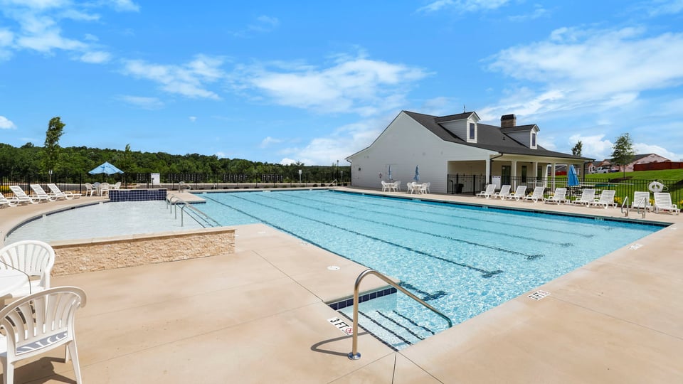 Pool amenity with chairs.