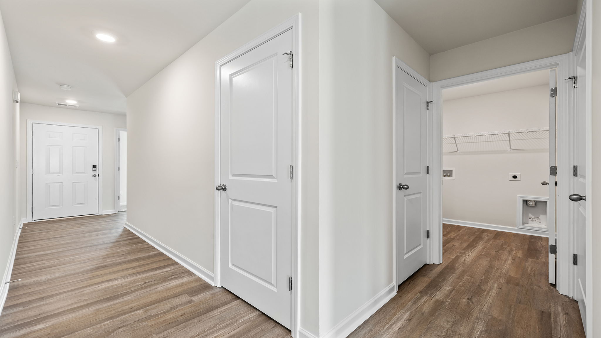 Hallway and view of the laundry room.