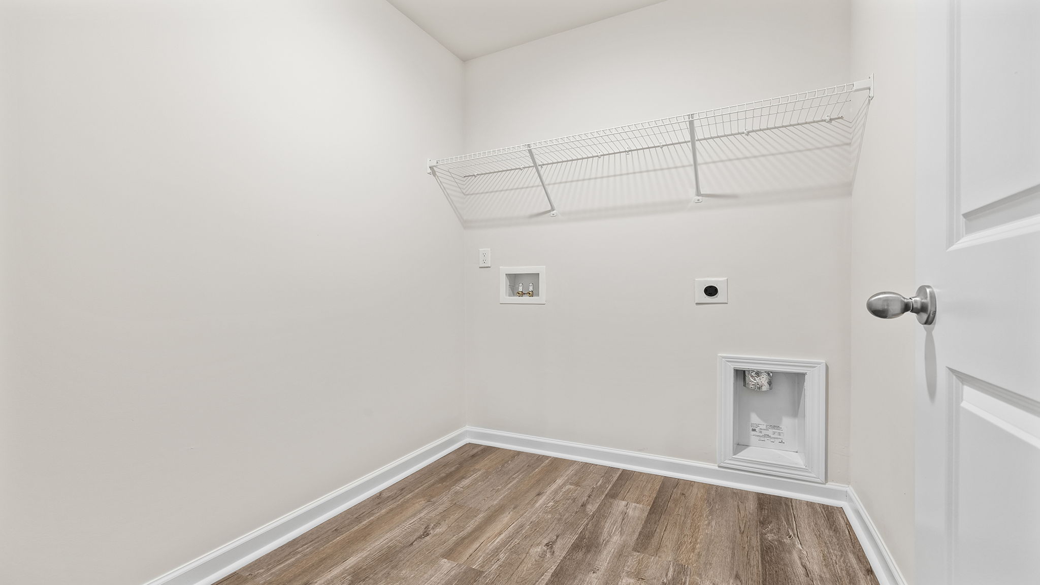 Laundry room with shelving.