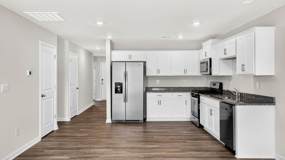 Kitchen with quartz countertops.