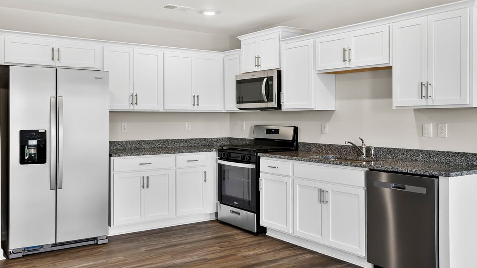 Kitchen with quartz countertops.