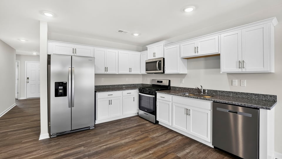Kitchen with quartz countertops.