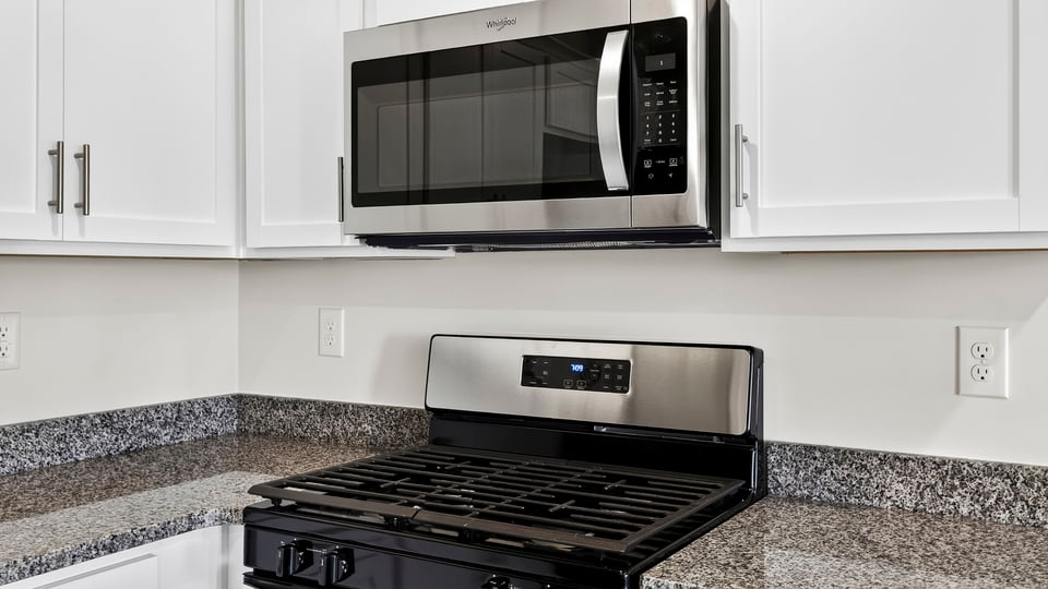 Kitchen with quartz countertops.