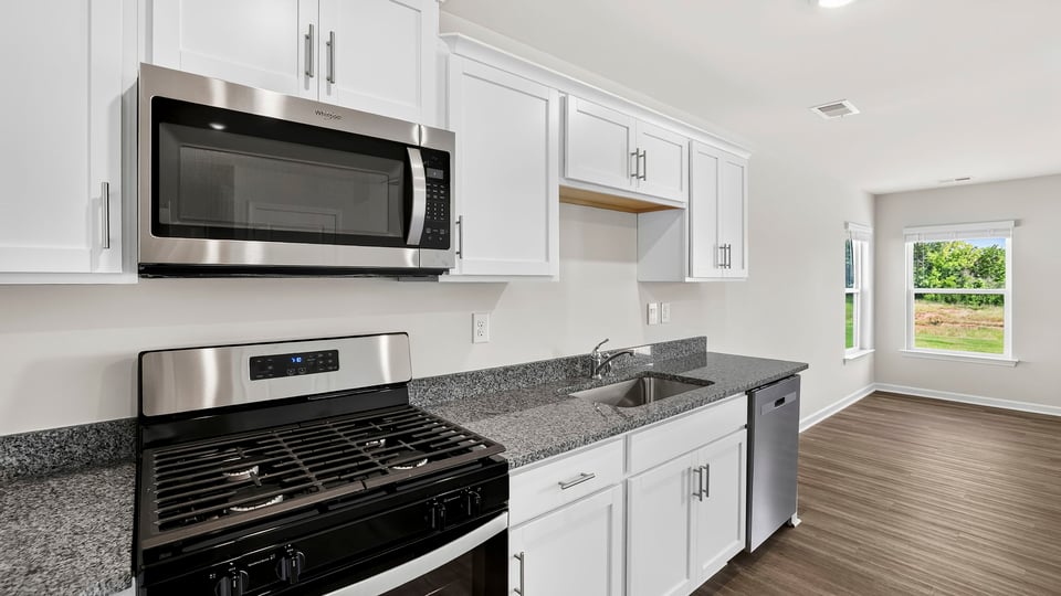 Kitchen with quartz countertops.