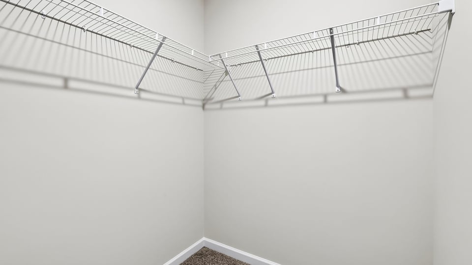 Closet with hanging storage racks.