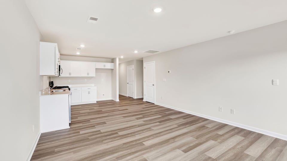 Kitchen with island and cabinets.
