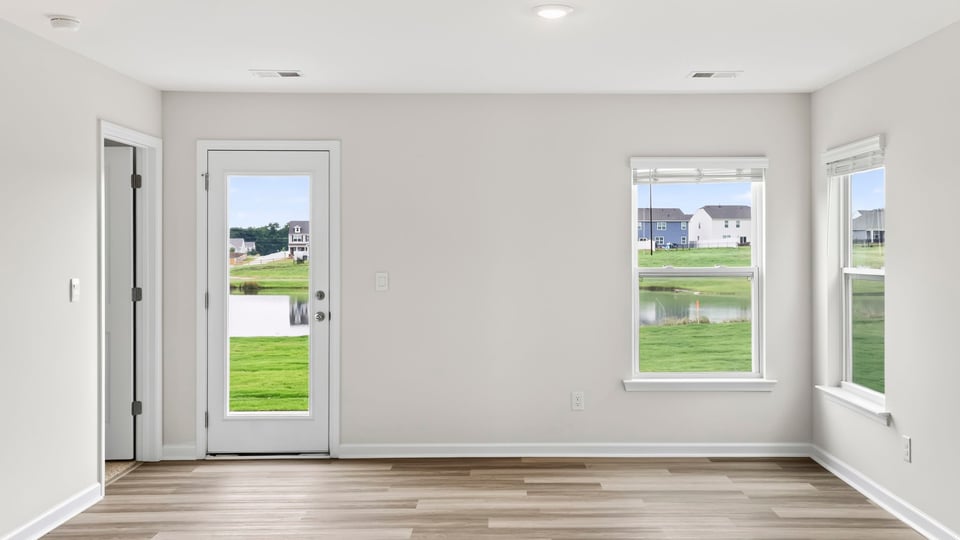 Bedroom with carpet and windows.