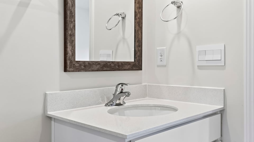 Primary bathroom with double vanity sinks.