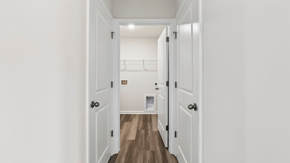 Primary closet with shelf.
