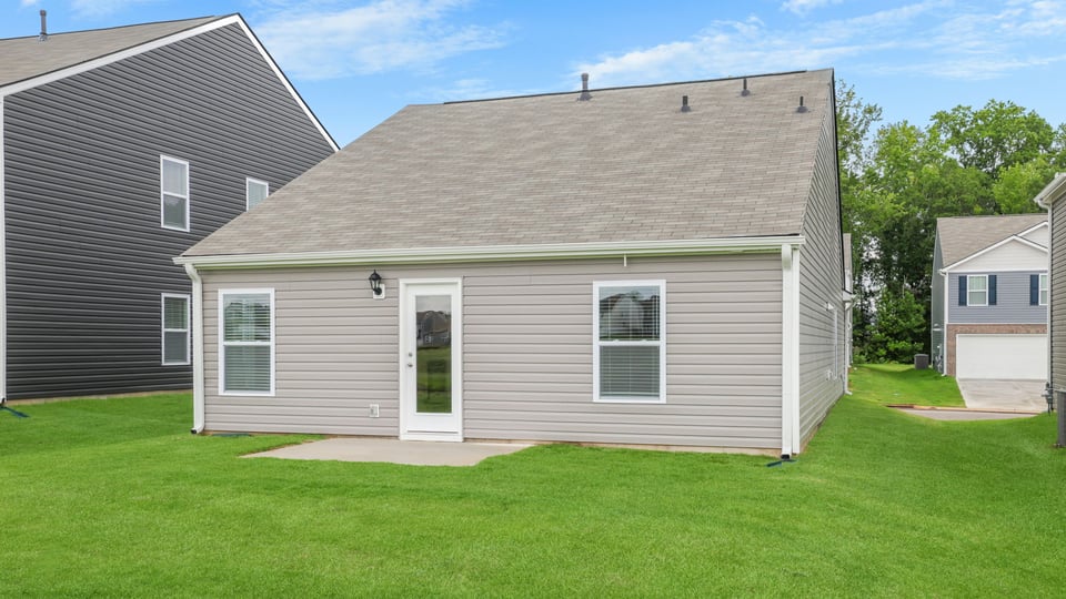 Back exterior with large backyard.