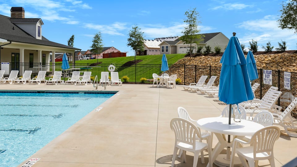 Pool amenity with chairs.