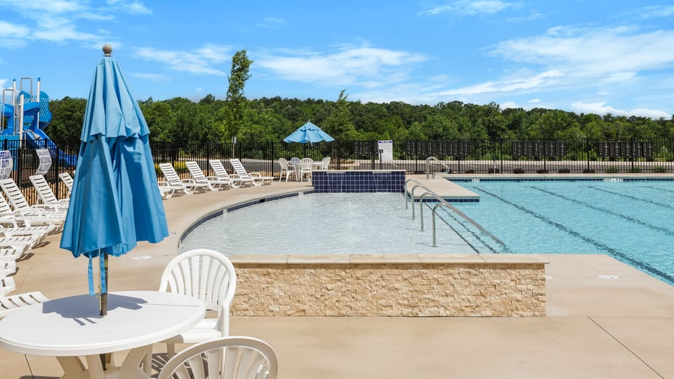 Pool amenity with chairs.