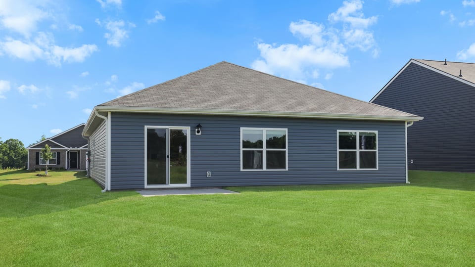 Back exterior with large backyard.