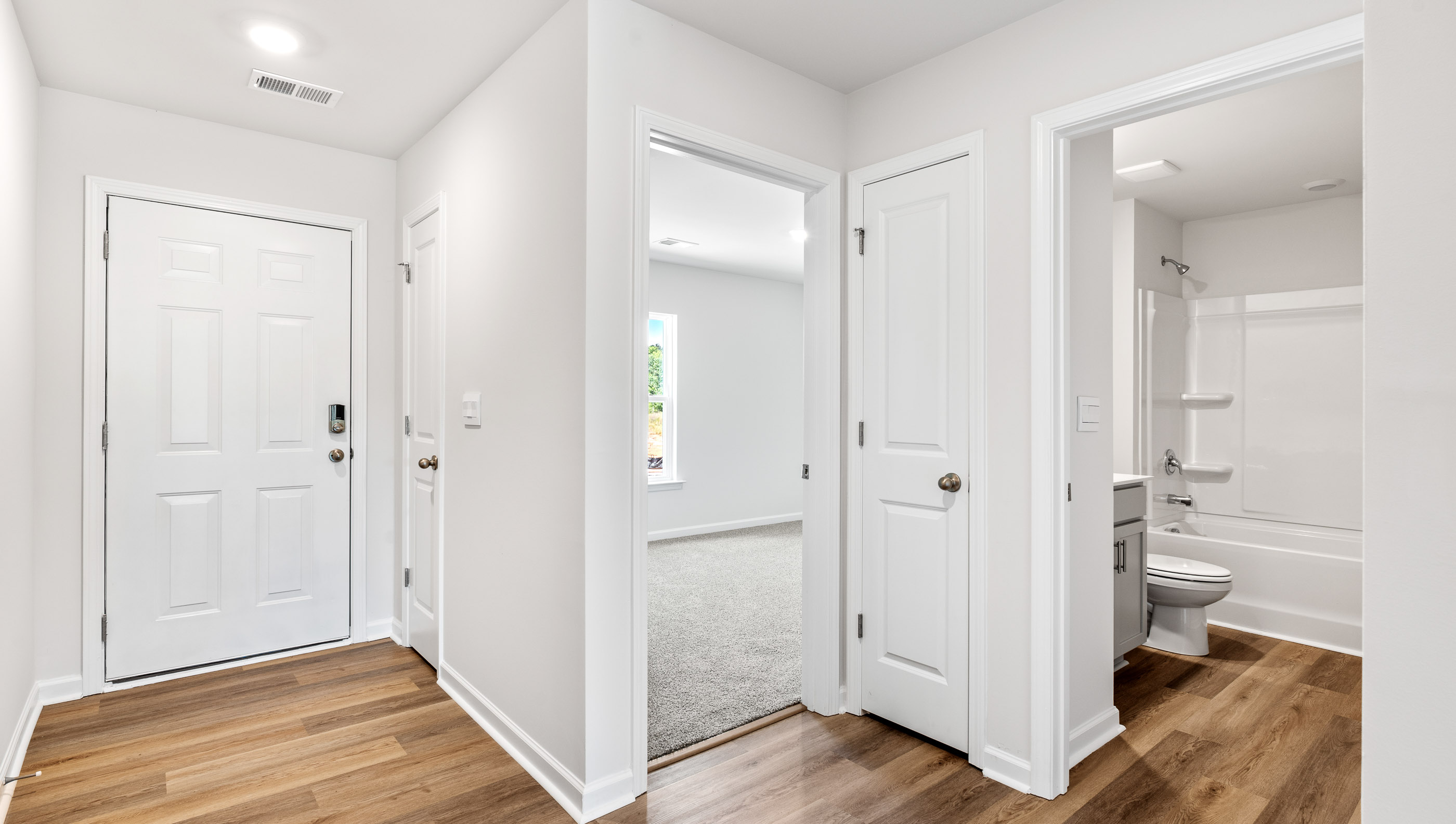 Entrance and view of the front bedroom and hall bathroom.