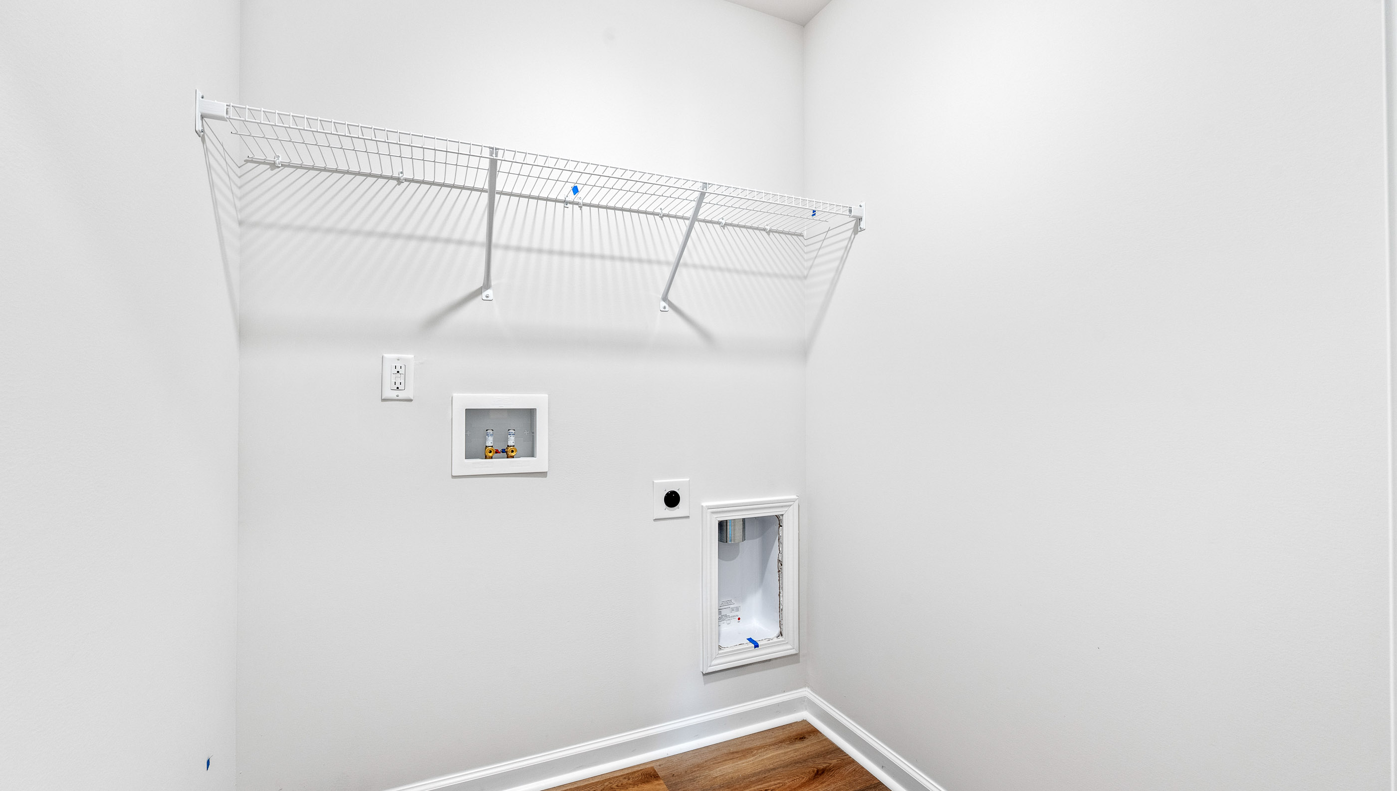 Laundry room with shelving.