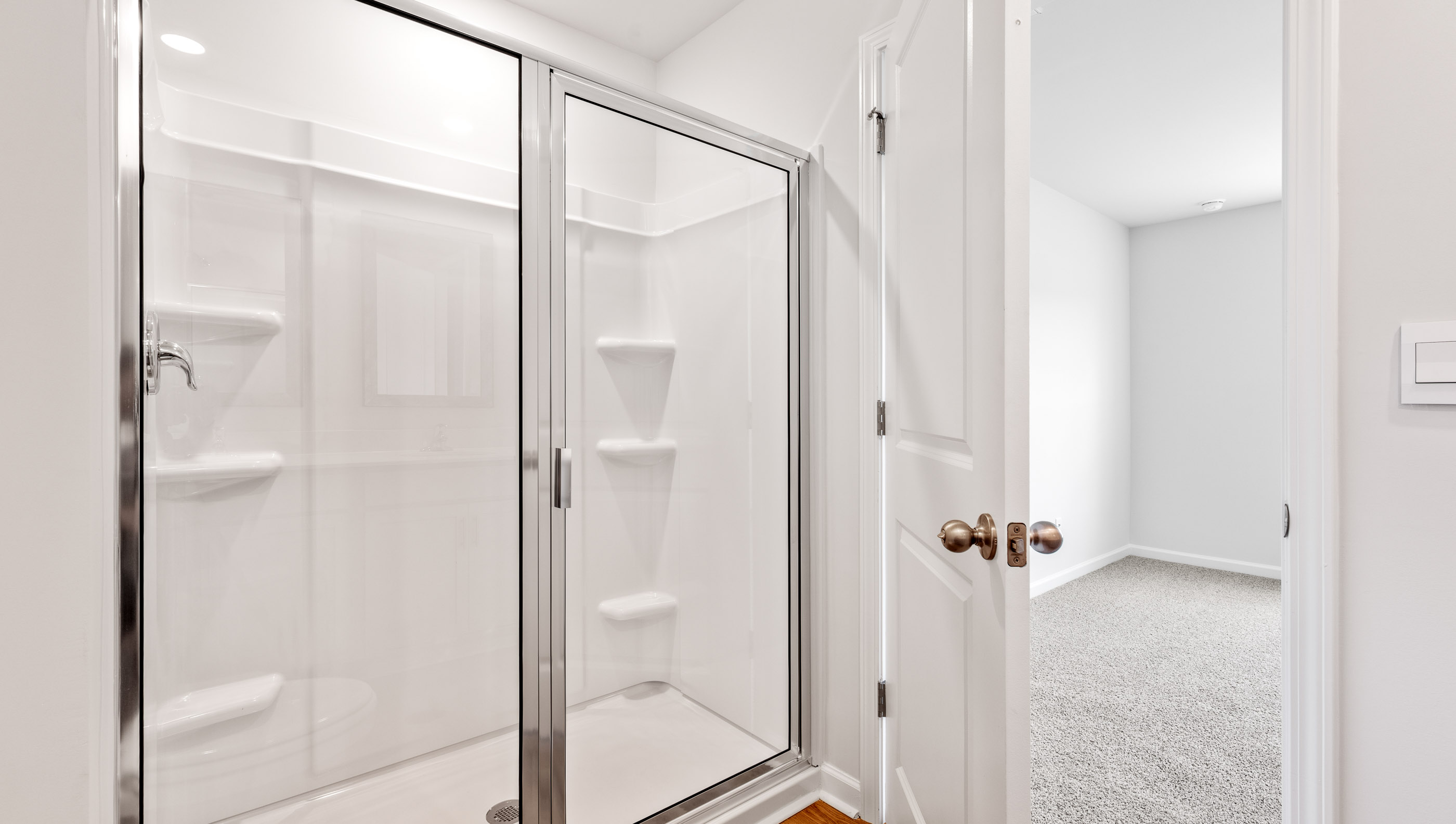 Primary bathroom with walk-in shower.