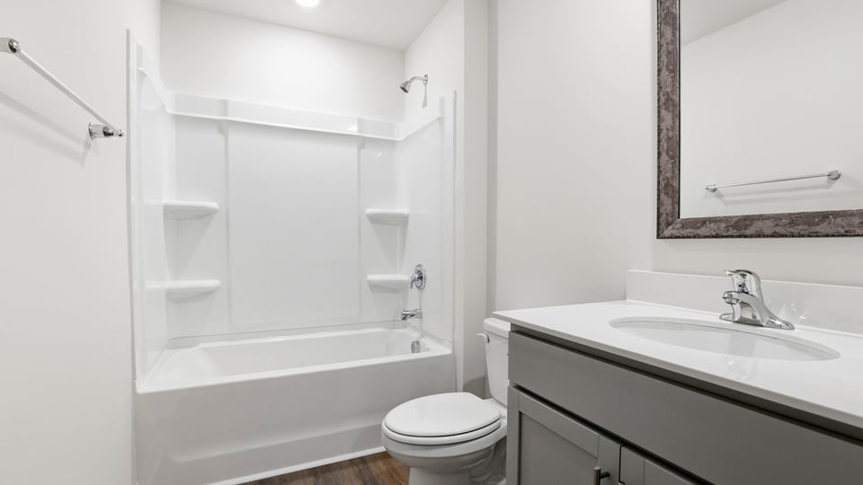 Bathroom with single vanity sink and bathtub.