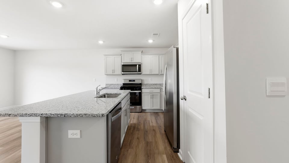 Bathroom with island and stainless steel appliances.