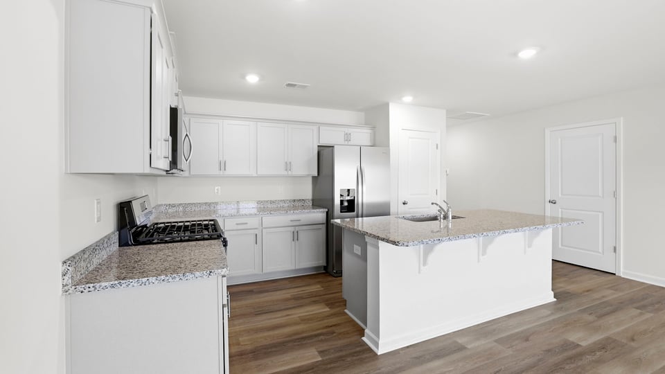 Bathroom with island and stainless steel appliances.