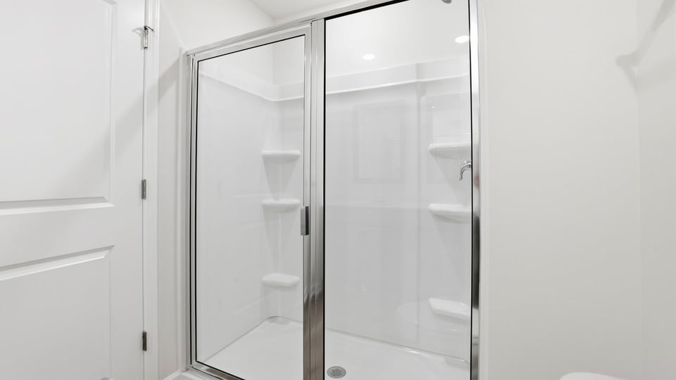 Bathroom with walk in shower.