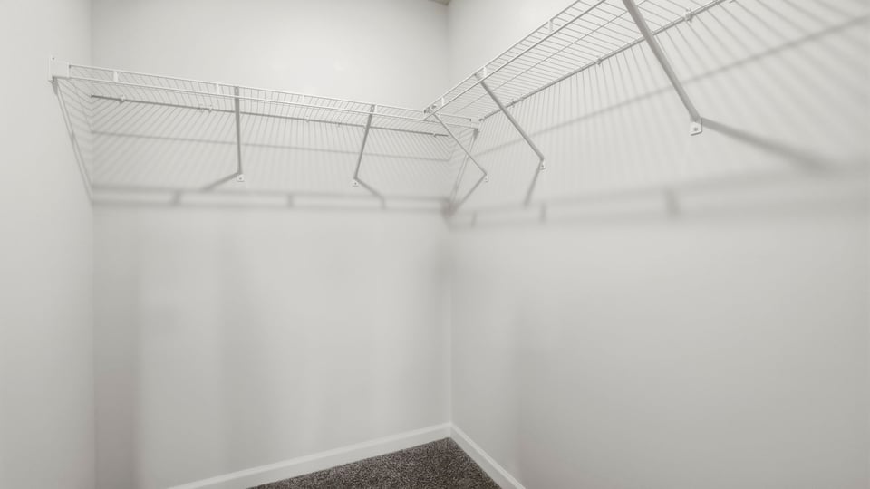 Closet with hanging shelves.