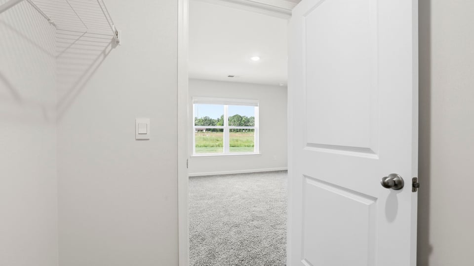 Closet with hanging shelves.