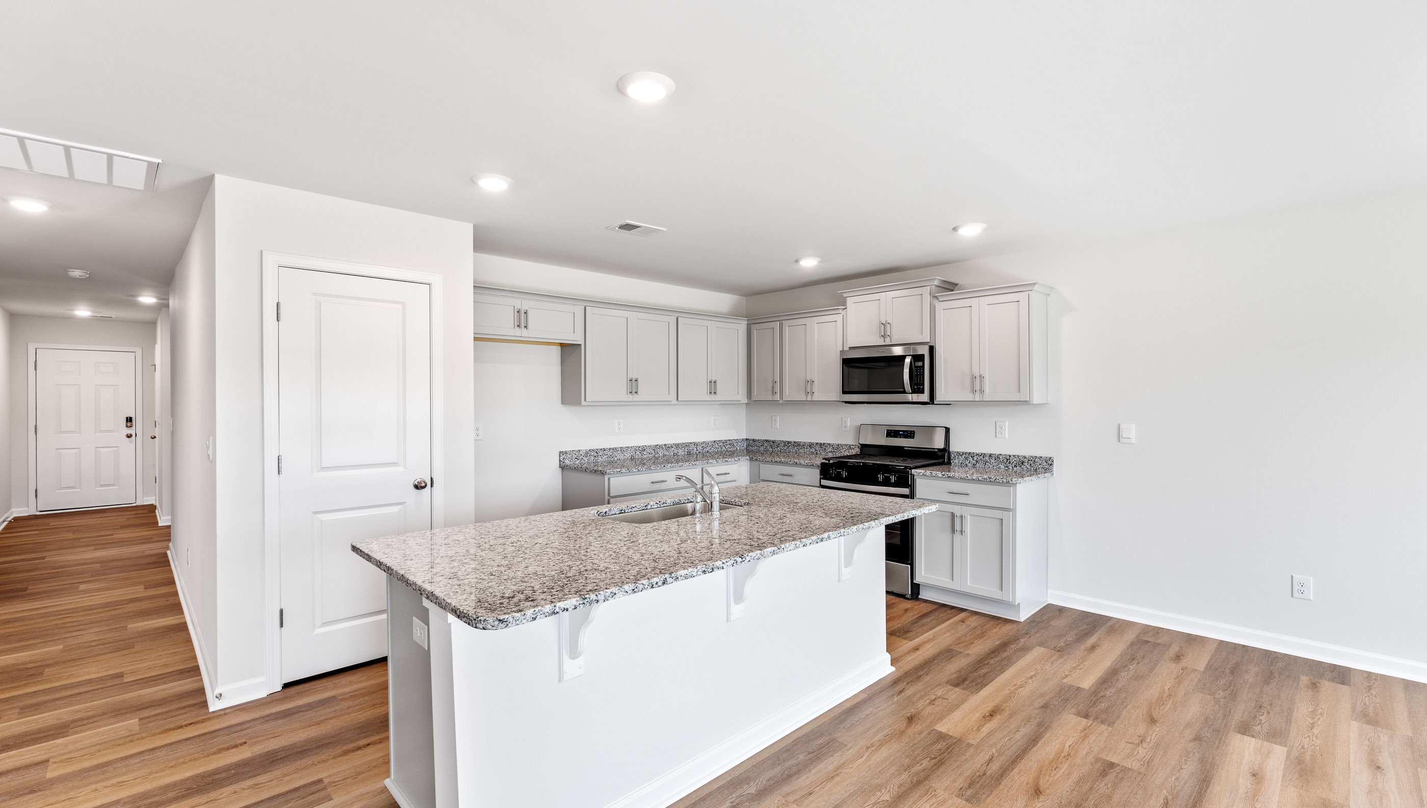 Kitchen with counter tops and stainless steel appliances.