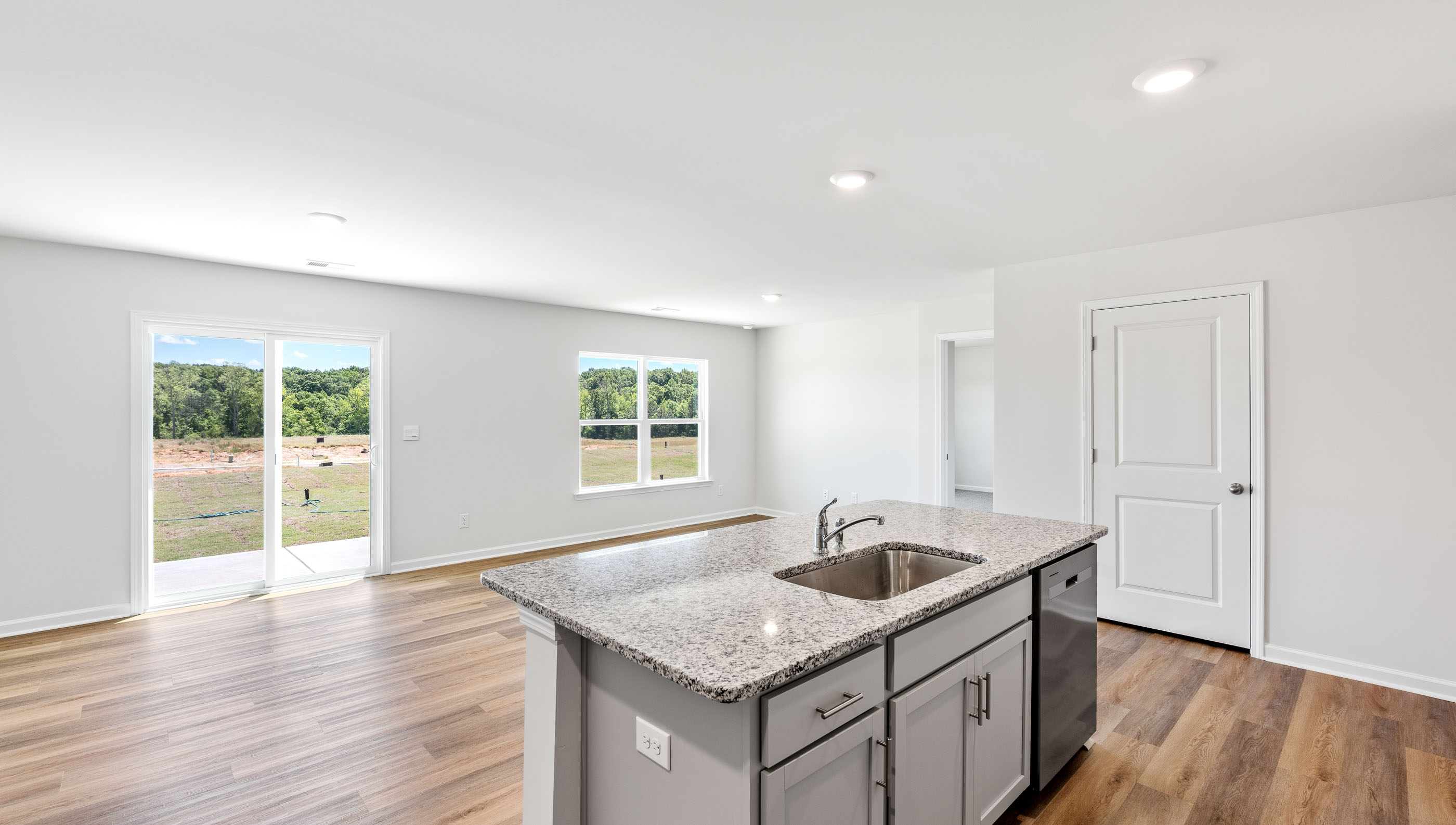 Kitchen with counter tops and stainless steel appliances.