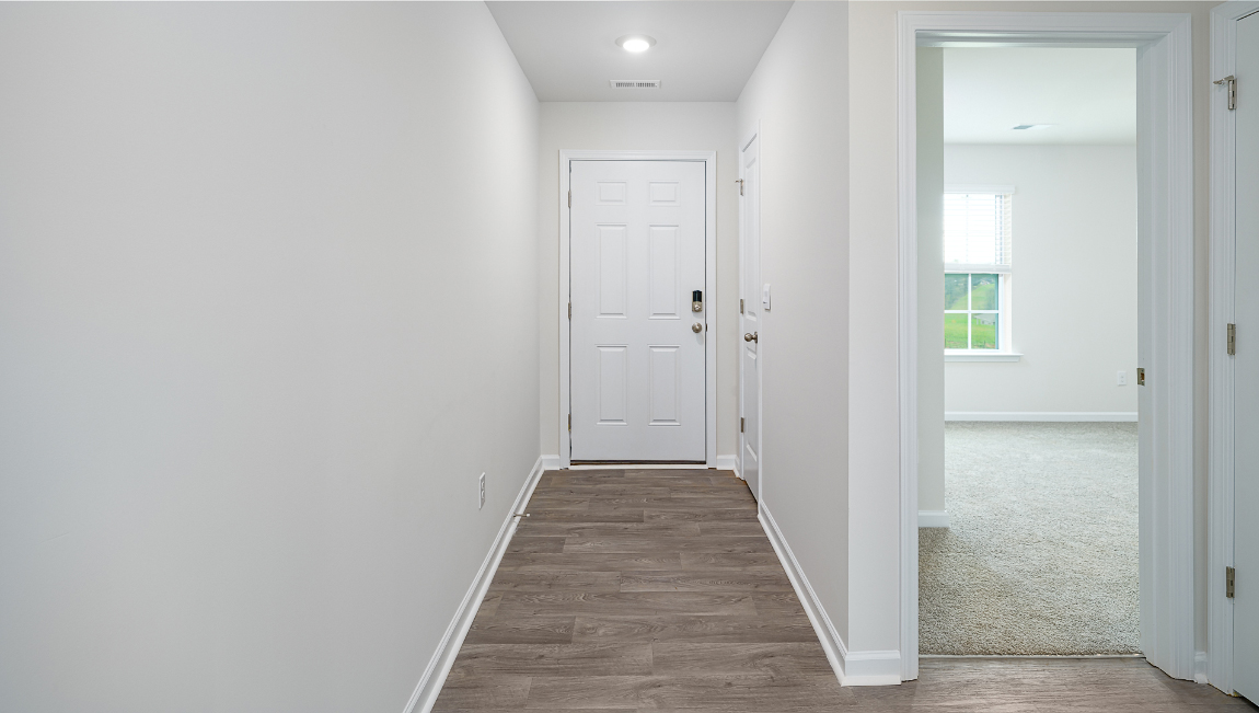 Entrance into home with view of rooms.