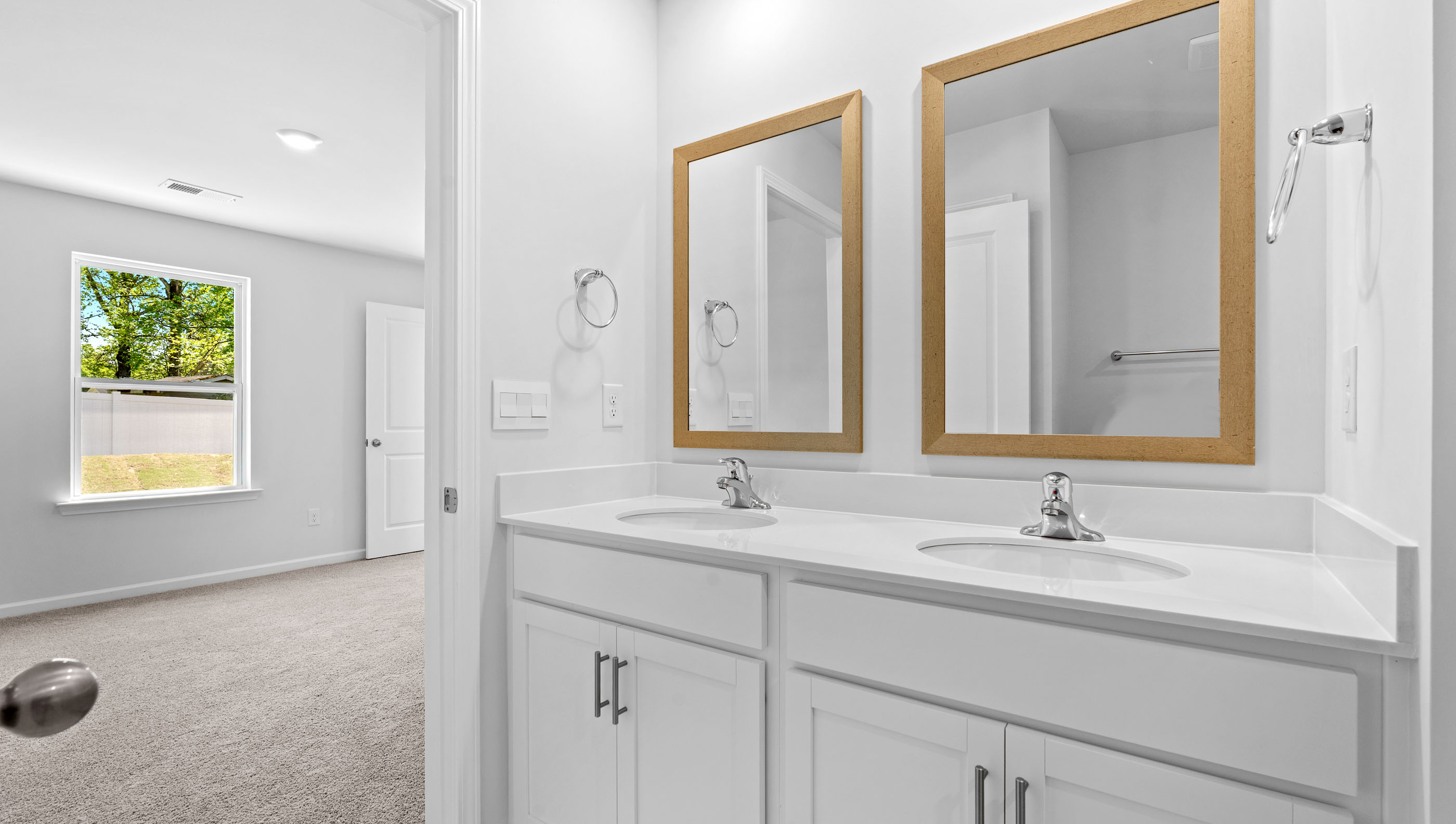 Primary bathroom with double vanity sinks.