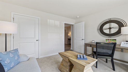 Bedroom with carpet and window.