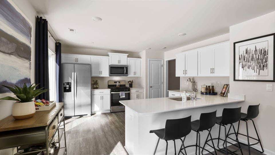 Kitchen with cabinets and windows.