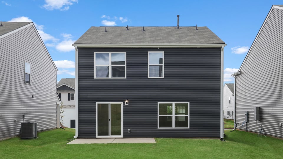 Back exterior with large backyard.