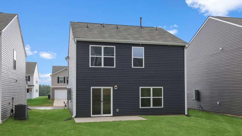 Back exterior with large backyard.