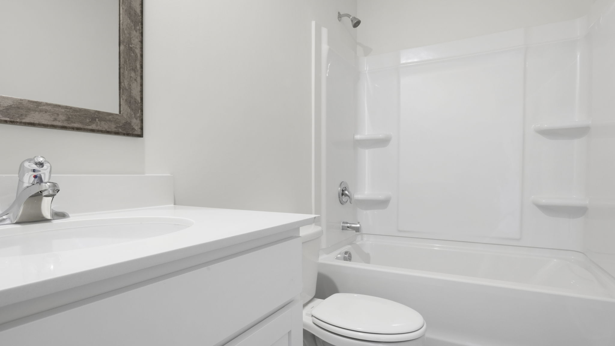 Bathroom with single vanity sink and tub.