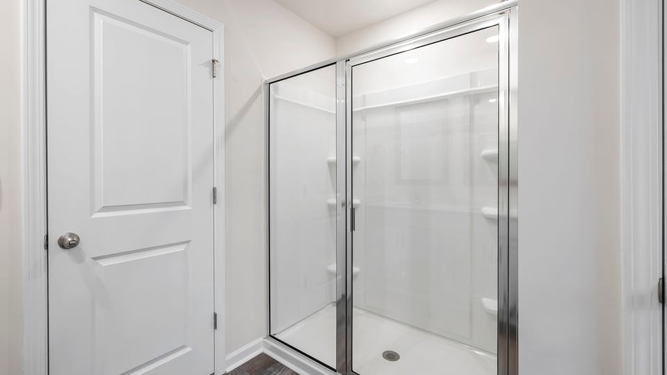 Primary bathroom with walk-in shower.