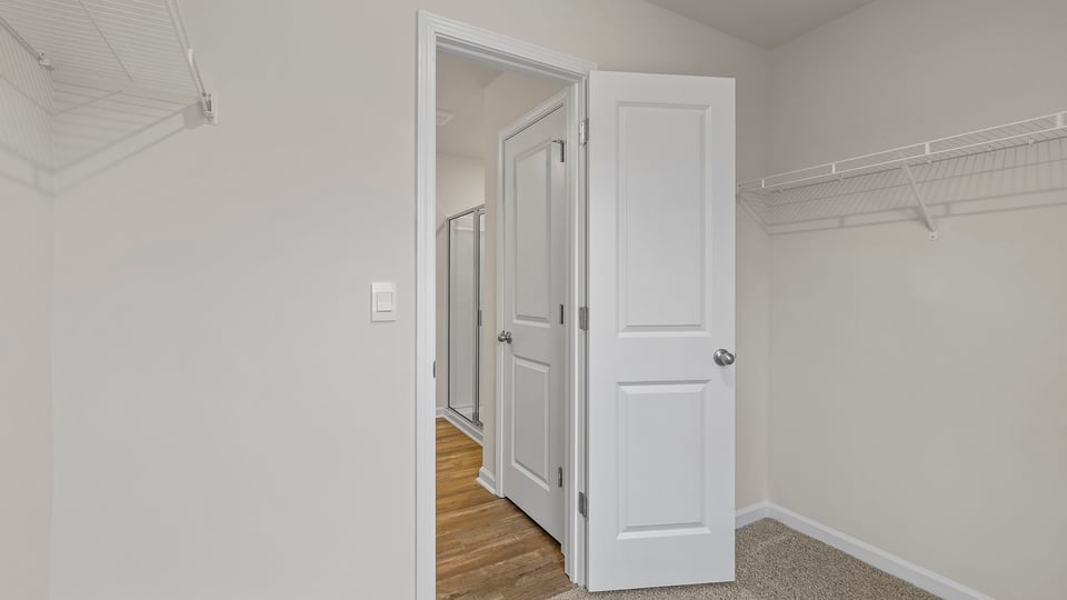 Primary bedroom walk-in closet.
