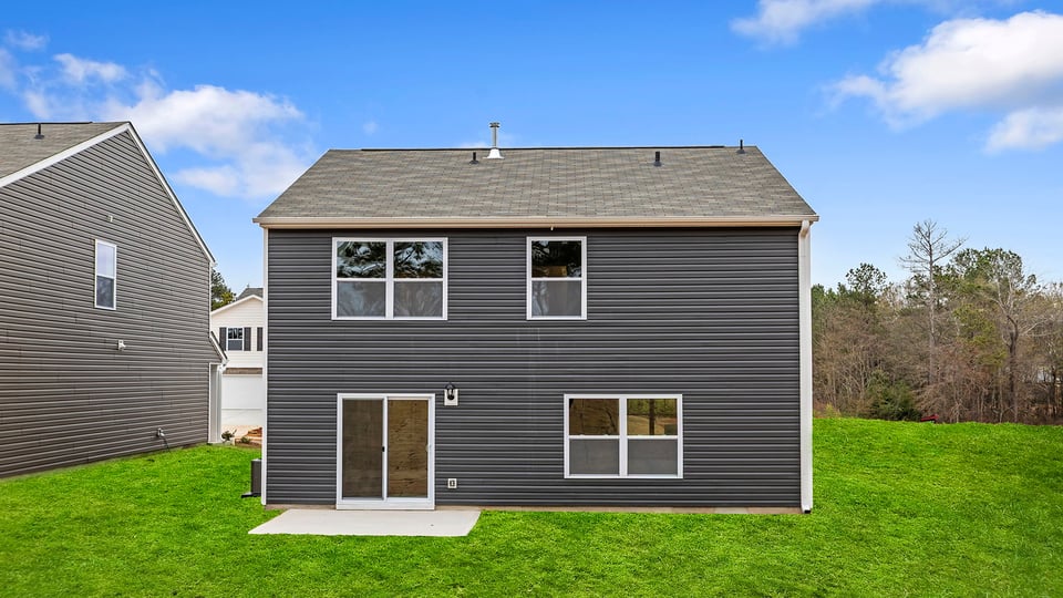 Back exterior view of home and patio.