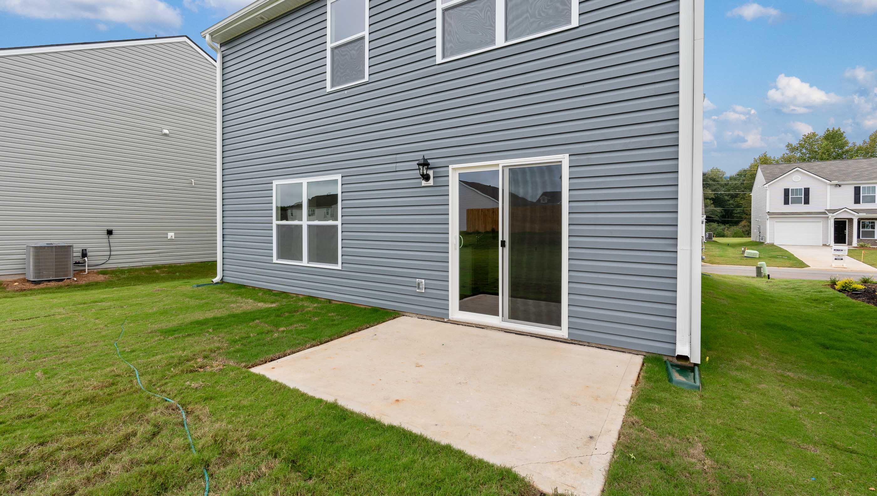 Back exterior with patio.