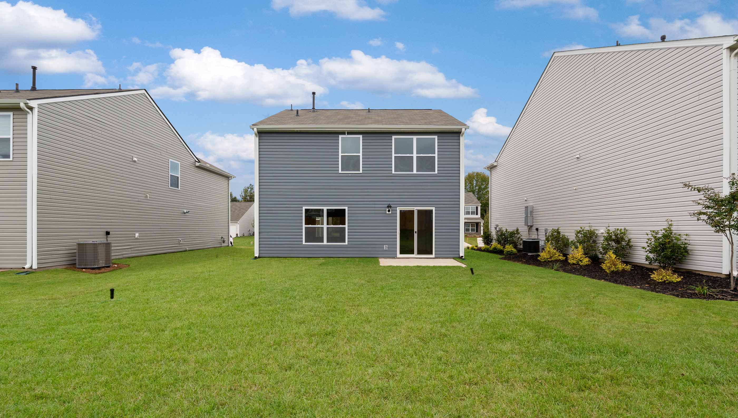 Back exterior with large backyard.