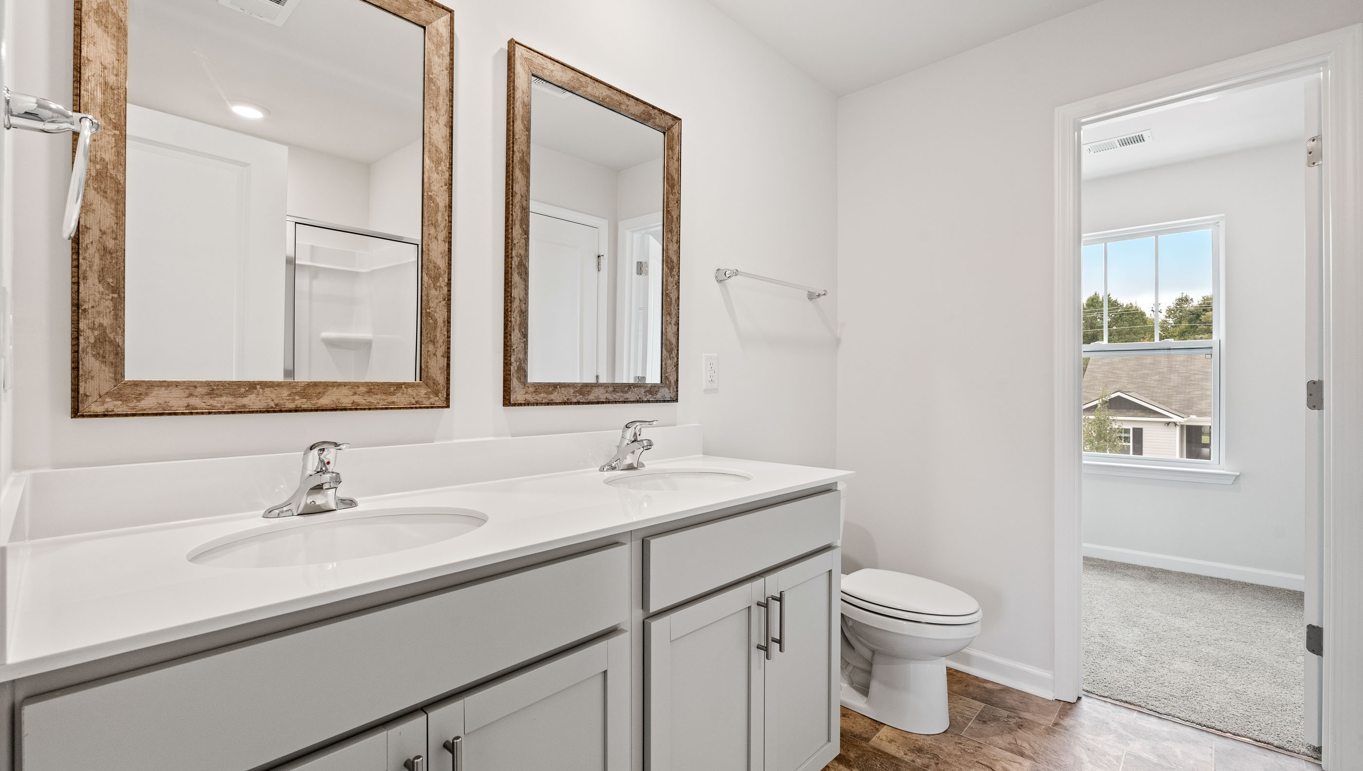 Primary bathroom with double vanity sinks.