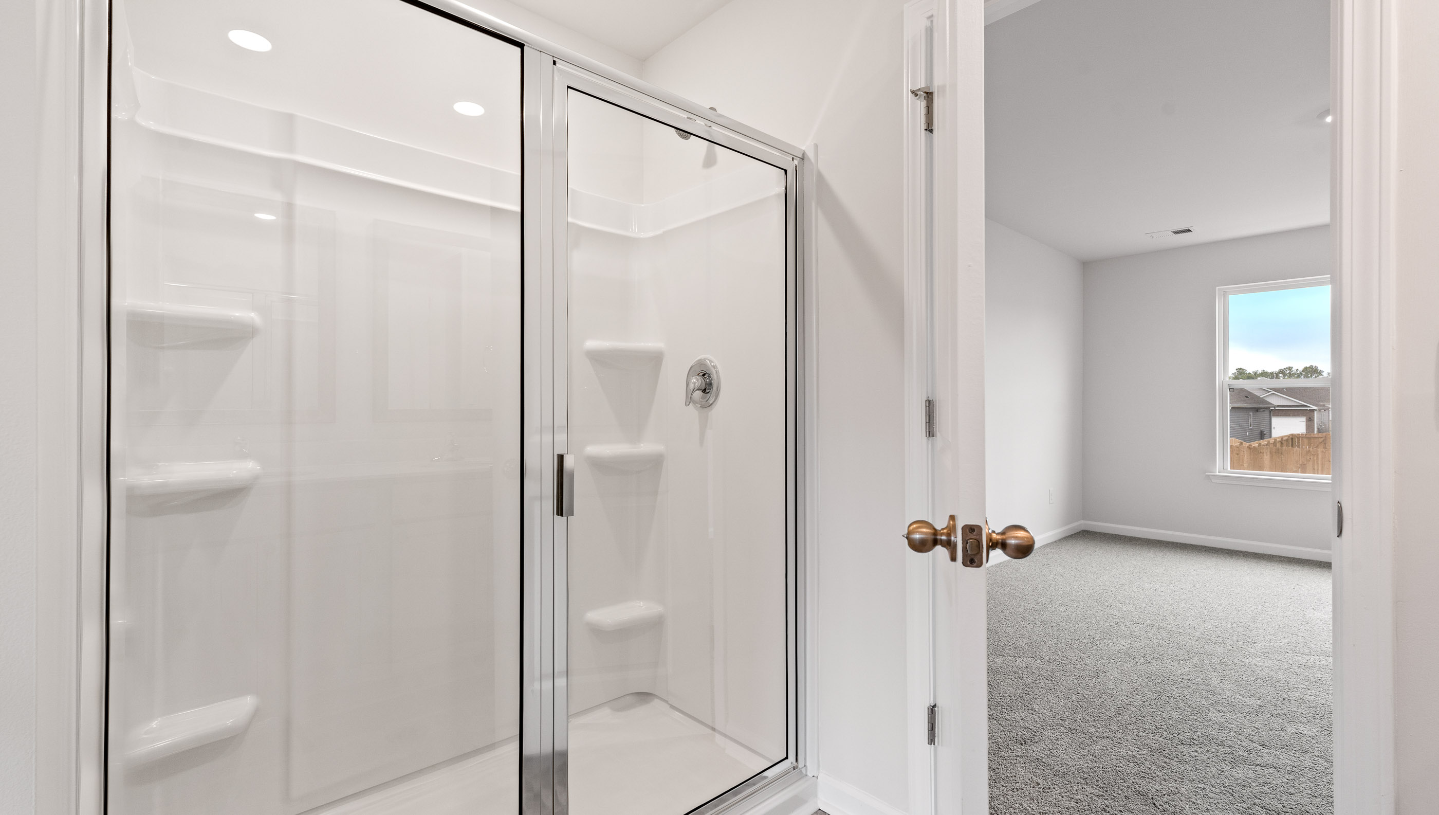 Primary bathroom with walk-in shower.