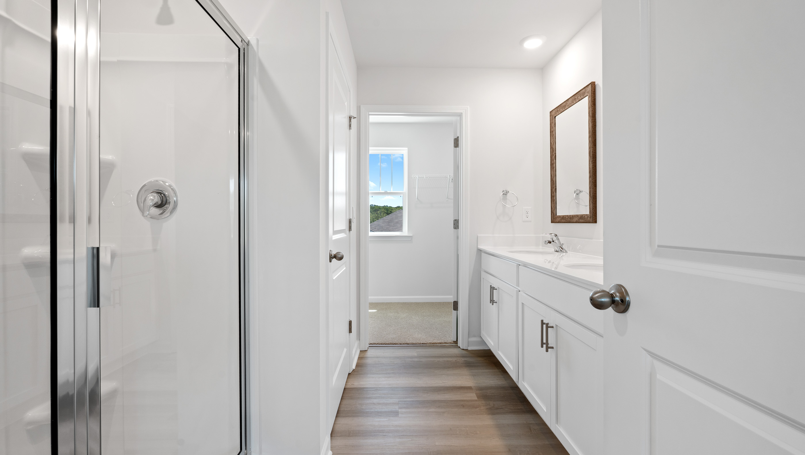 Primary bathroom with double vanity sinks.