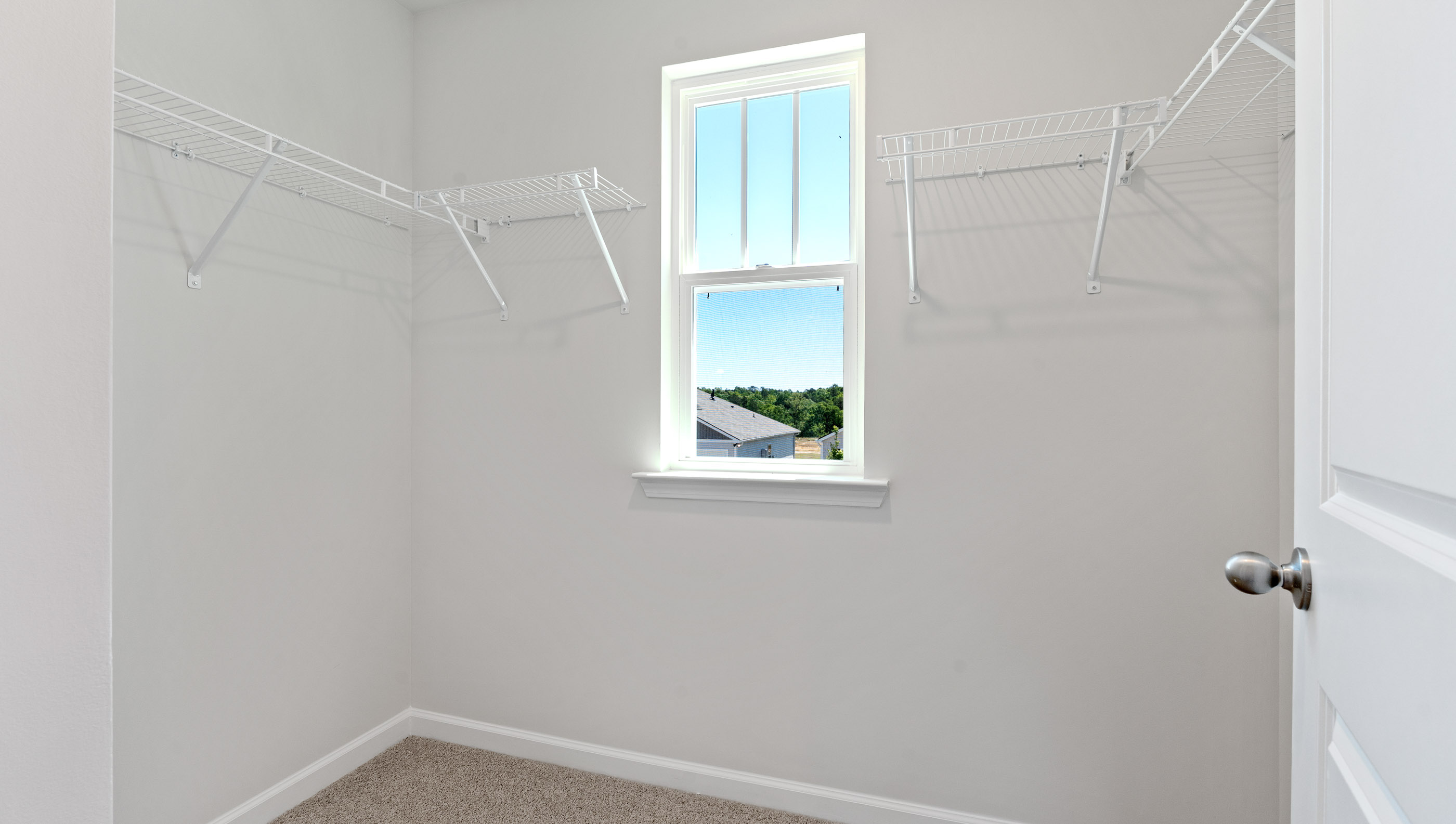 Primary closet with window.