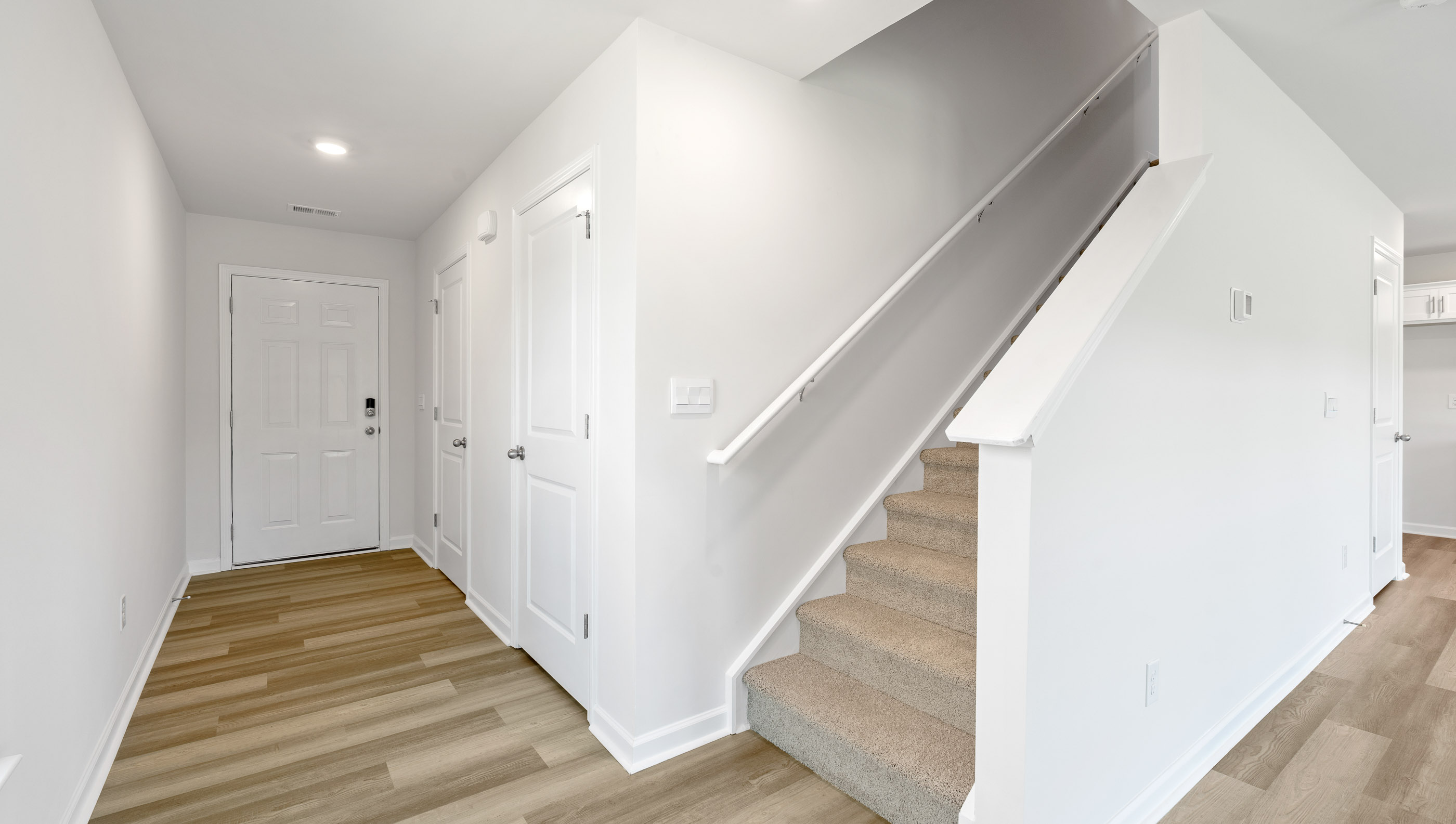 Entrance and stairwell to upper level.