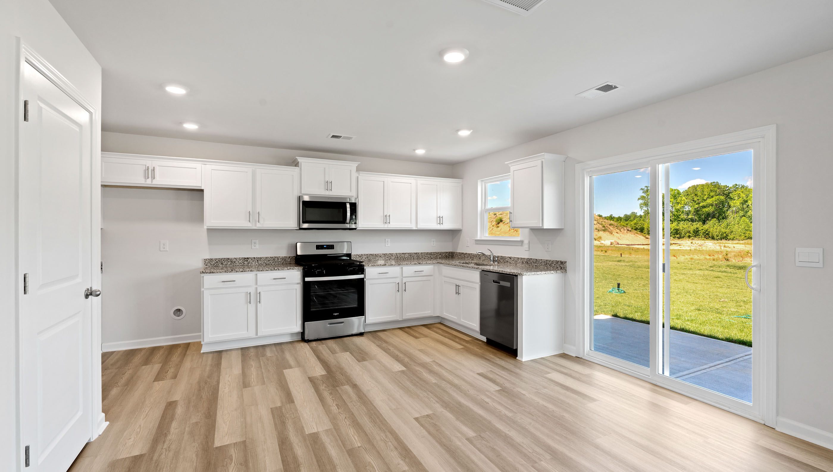 Kitchen with granite countertops.