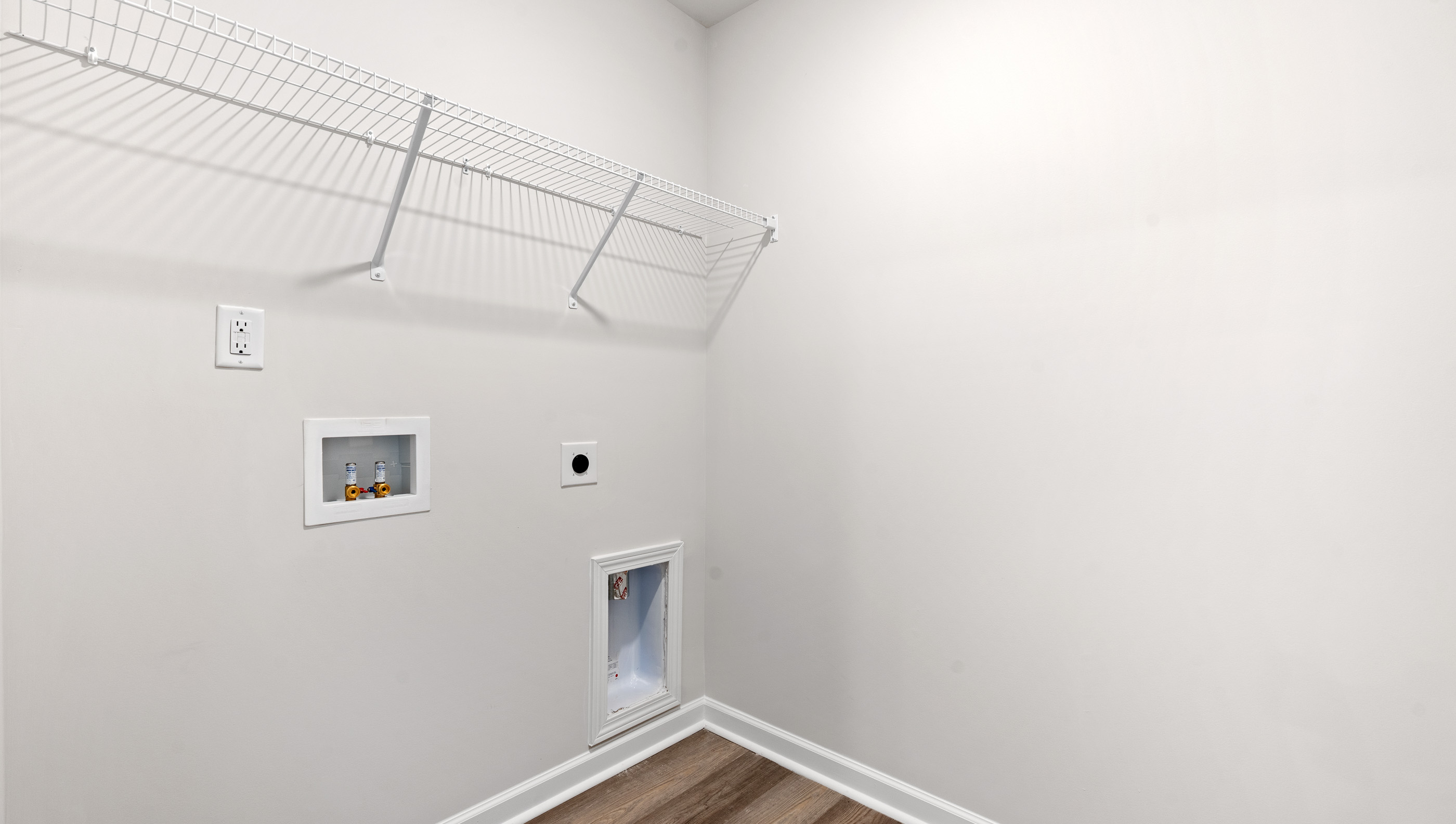 Utility closet with hook ups.