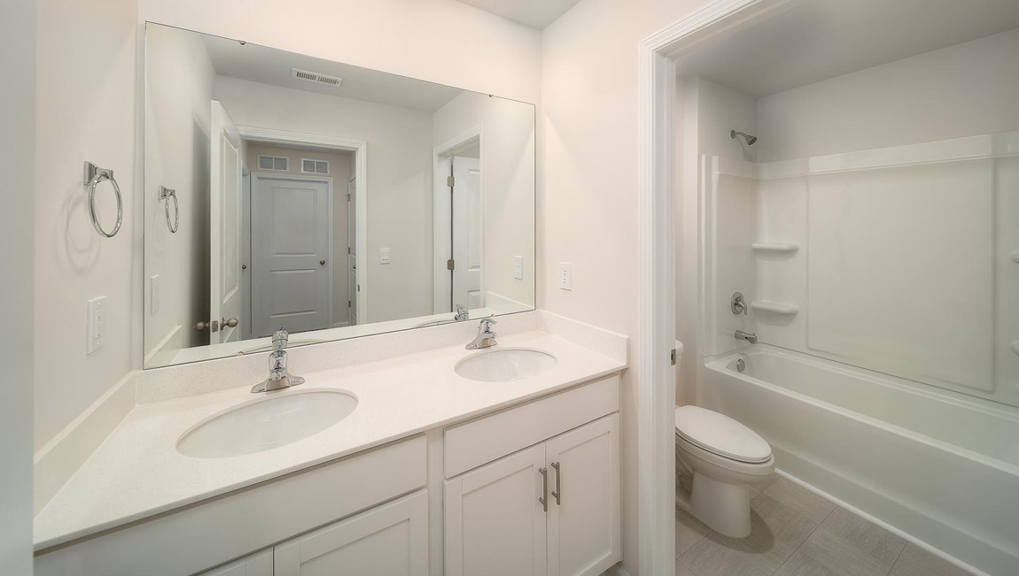Bathroom with sink and shower.